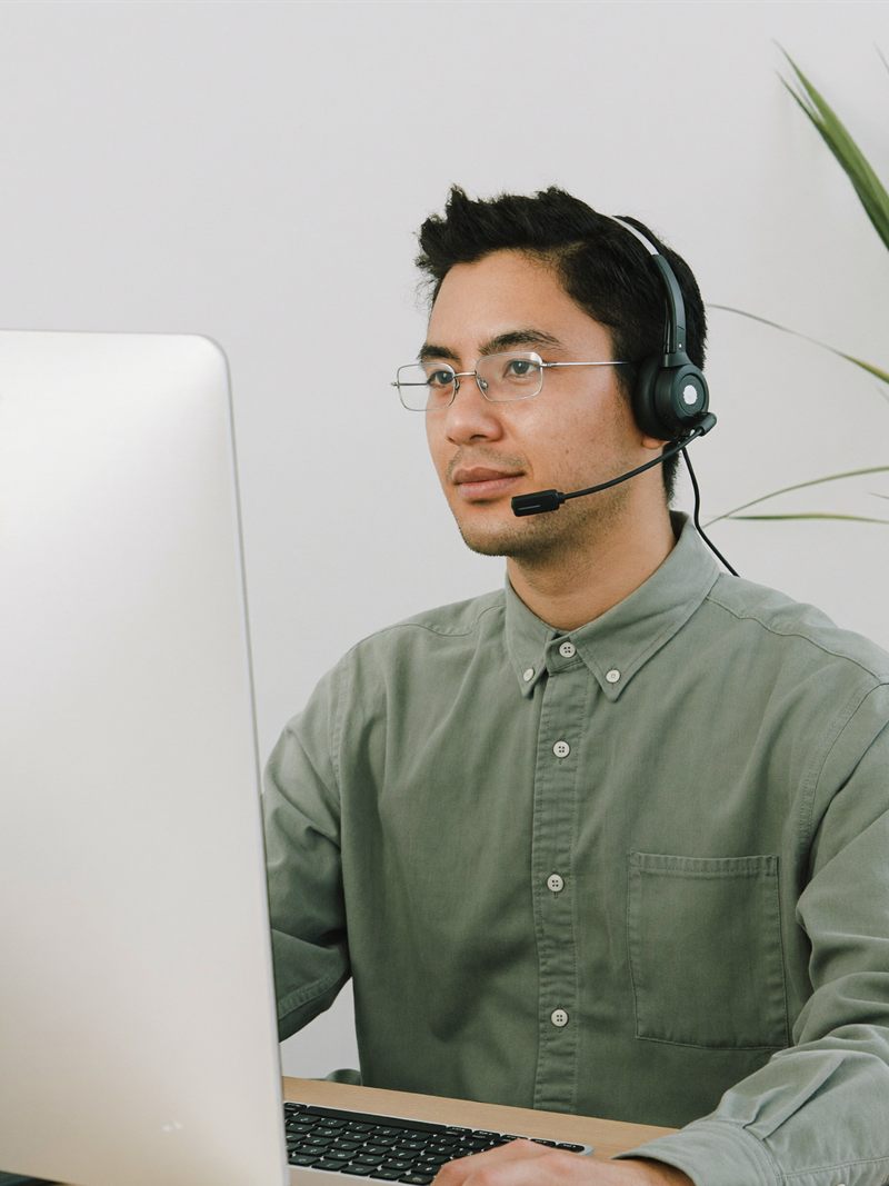 A medical billing assistant reviewing claims on screen